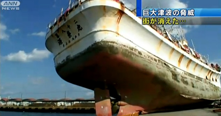 A perfect shot of a large ocean going ship placed on a dock as a child playing in the harbor.  